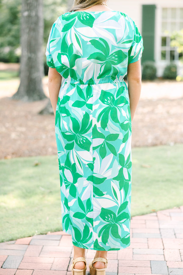 Chic Soul plus size clothing, short-sleeve green flowy dress with a v-neckline and a smocked tied waistline with a blue and green tropical floral pattern