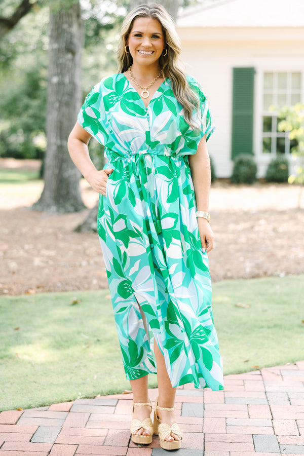 Chic Soul plus size clothing, short-sleeve green flowy dress with a v-neckline and a smocked tied waistline with a blue and green tropical floral pattern