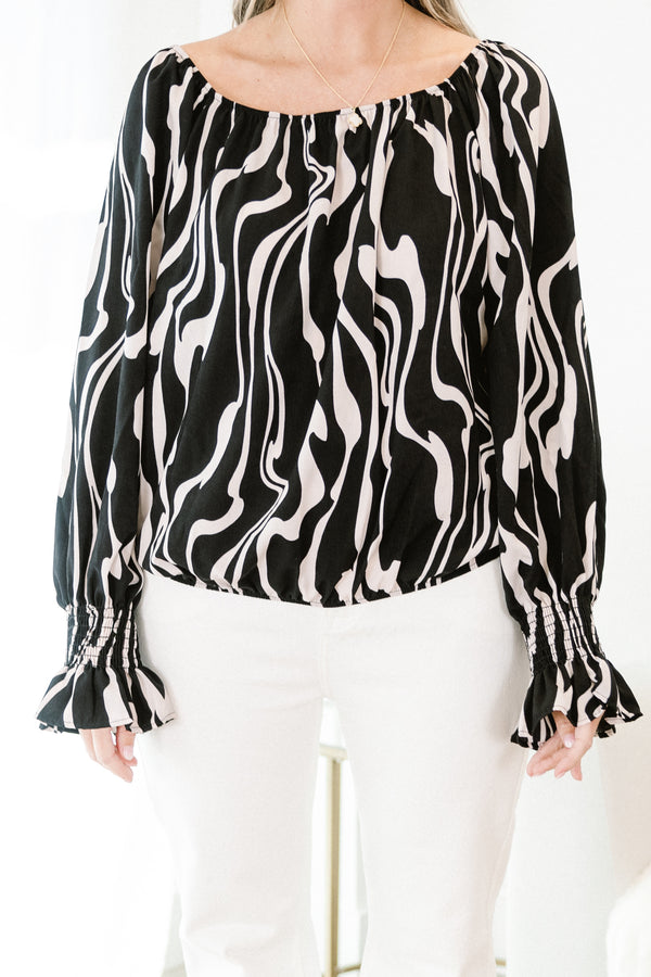 Chic Soul plus size clothing, long-sleeve black top with a scoop-neckline and a white marble abstract pattern with smocked detailing on the wrist of the sleeves 