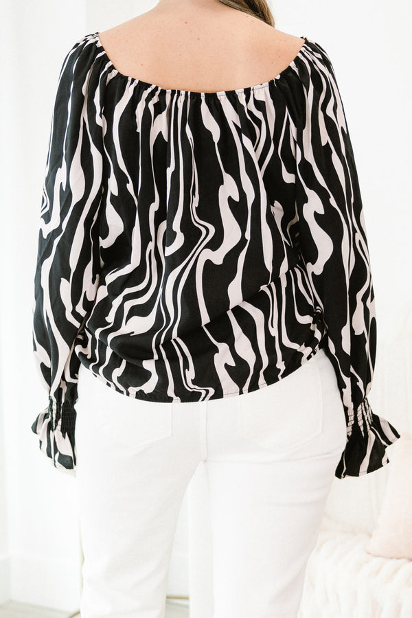 Chic Soul plus size clothing, long-sleeve black top with a scoop-neckline and a white marble abstract pattern with smocked detailing on the wrist of the sleeves 