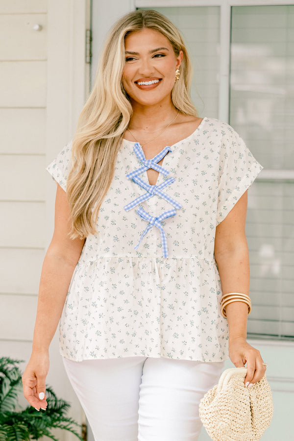 Chic Soul plus size clothing, white short sleeve top with blue small floral pint with blue gingham ties down the center
