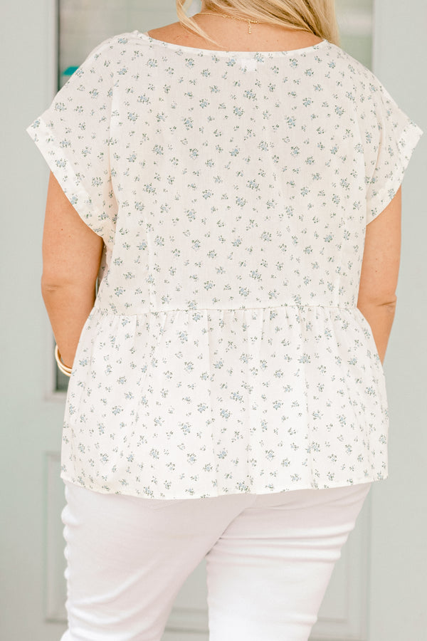 Chic Soul plus size clothing, white short sleeve top with blue small floral pint with blue gingham ties down the center
