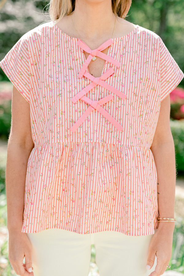 Chic Soul plus size clothing, pink stripe short sleeve top with ruffle along the bottom with bow tie detail along the front