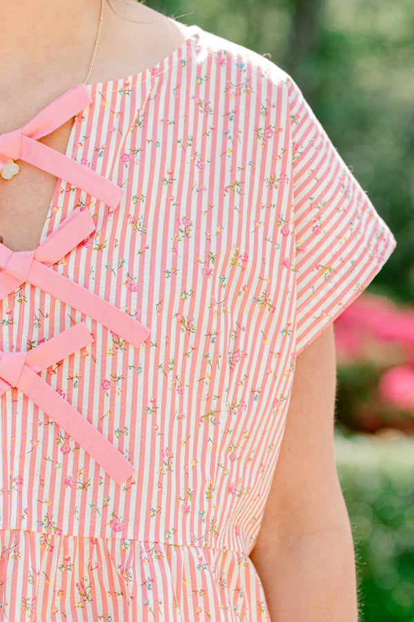 Chic Soul plus size clothing, pink stripe short sleeve top with ruffle along the bottom with bow tie detail along the front