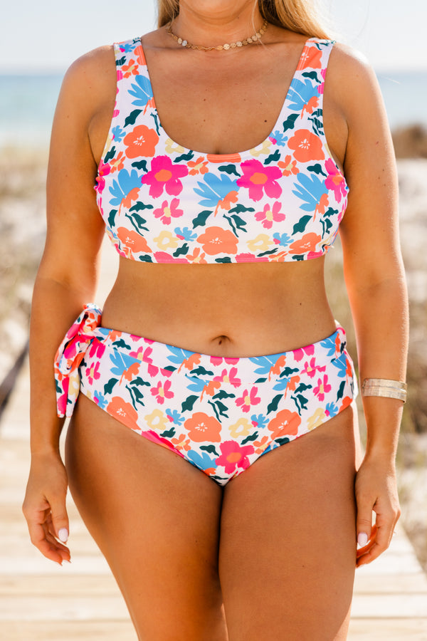 Chic Soul plus size clothing, sleeveless white swim top with a scoop-neckline and a pink multi-colored floral pattern 