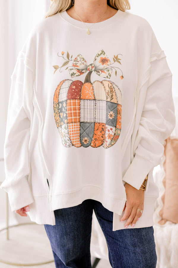 Chic Soul plus size clothing, off white crewneck with a quilt patch patterned pumpkin topped with a bow on the stem 