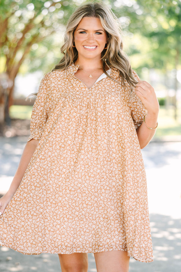 Plus Size brown floral mini dress with a V-neckline, short puff sleeves, and a relaxed babydoll fit.