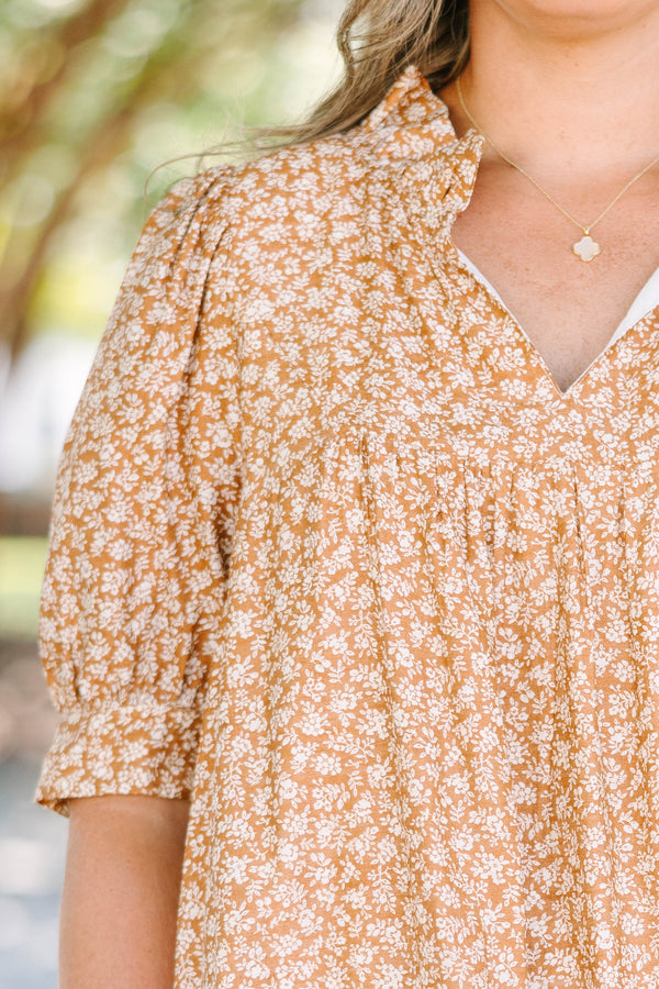 Plus Size brown floral mini dress with a V-neckline, short puff sleeves, and a relaxed babydoll fit.