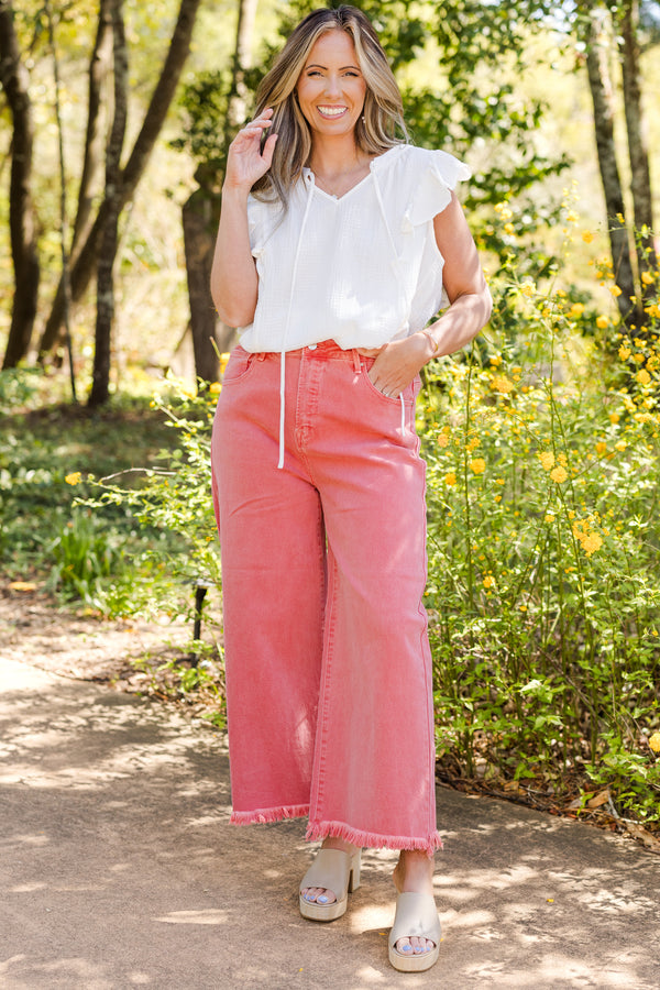 Chic Soul plus size clothing, high-waisted peach blossom pink cropped wide-leg jeans with fraying along the hemline 