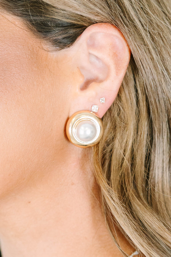 Gold Pearl Darling Earrings with a large pearl center and gold rim.