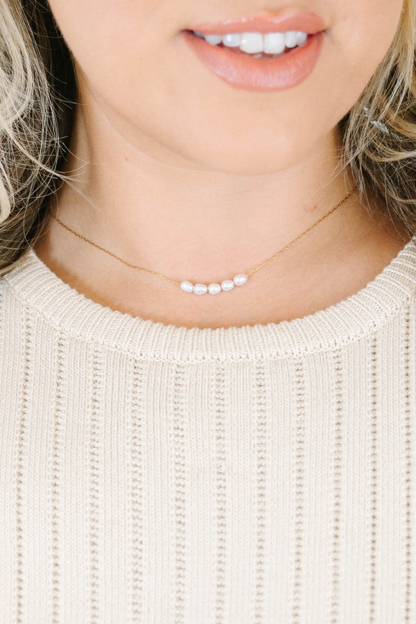 Gold necklace adorned with five dainty pearls with lobster clasp and extender