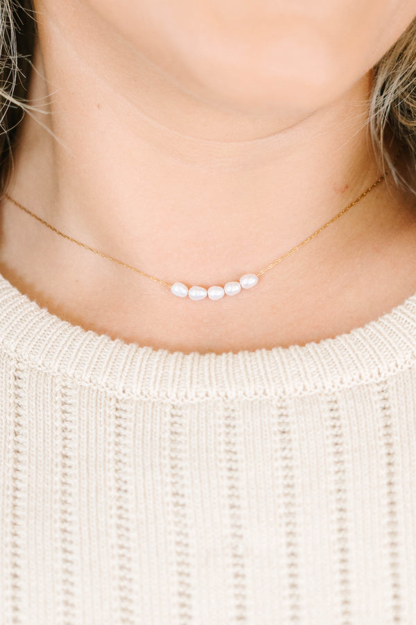 Gold necklace adorned with five dainty pearls with lobster clasp and extender