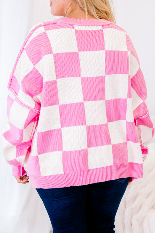 long-sleeve pink and cream checkered sweater with crew neckline and subtly distressed stitching 