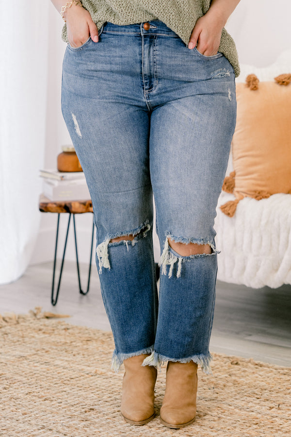 Chic Soul plus size clothing, medium wash distressed denim jeans with rips at the knees and fringe hem