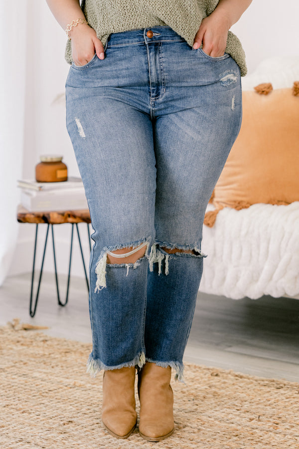 Chic Soul plus size clothing, medium wash distressed denim jeans with rips at the knees and fringe hem