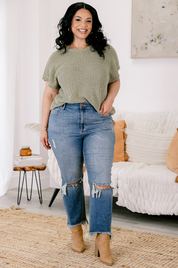 Chic Soul plus size clothing, medium wash distressed denim jeans with rips at the knees and fringe hem