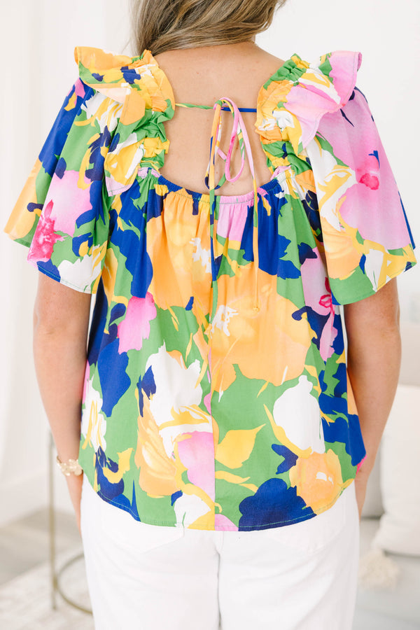 Plus Size green blouse with a bold floral print, square neckline, and ruffled short sleeves.
