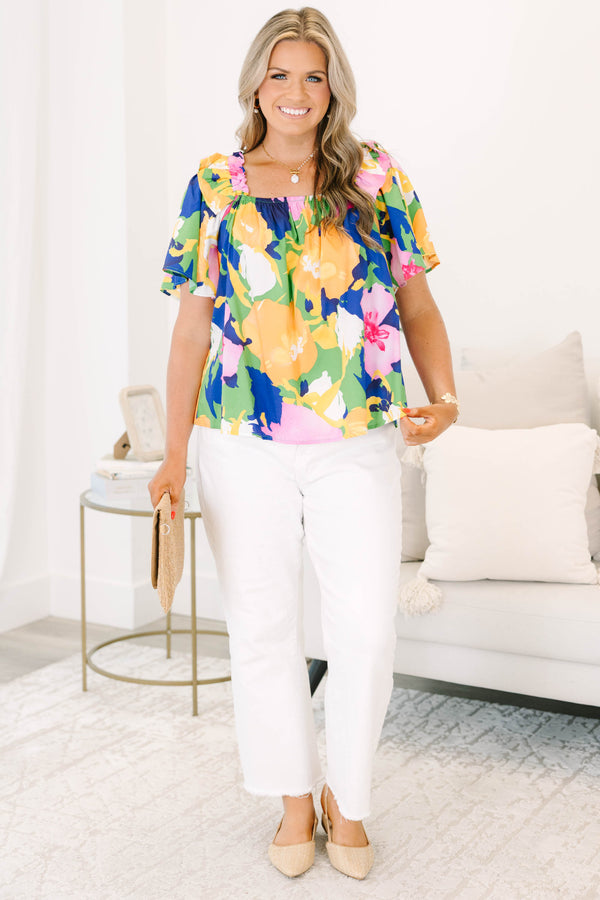 Plus Size green blouse with a bold floral print, square neckline, and ruffled short sleeves.