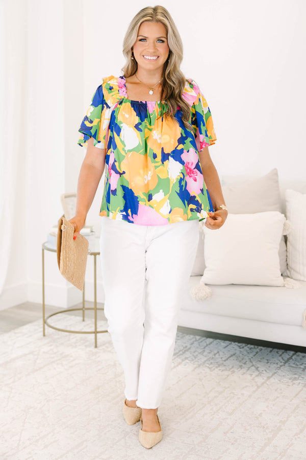 Plus Size green blouse with a bold floral print, square neckline, and ruffled short sleeves.