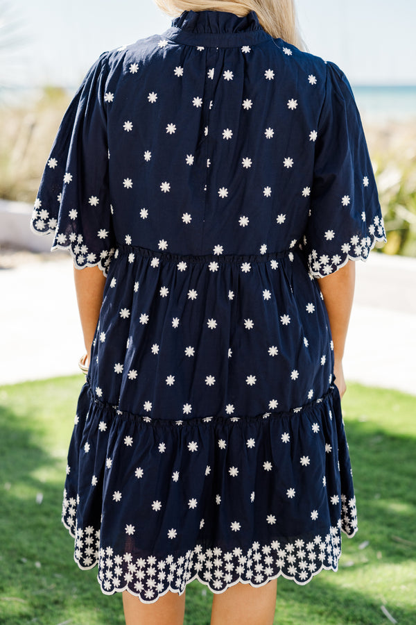 Chic Soul plus size clothing, short-sleeve navy blue ruffled baby doll dress with a split-v-neckline and white embroidered floral detailing along the dress with a scalloped embroidered hem