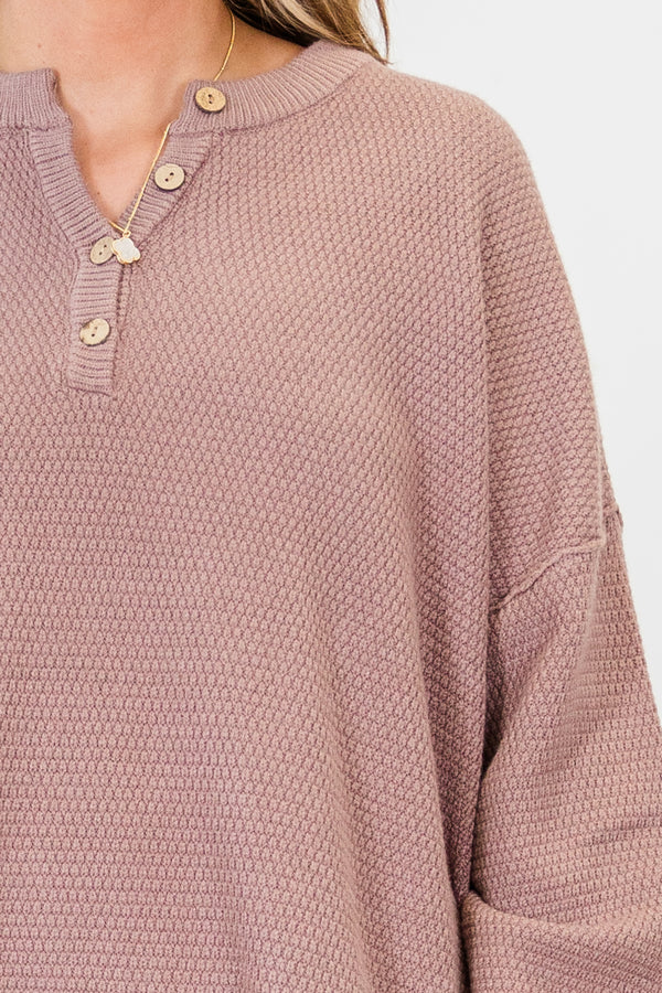 Plus Size taupe knit sweater with a buttoned henley neckline and drop shoulder long sleeves.