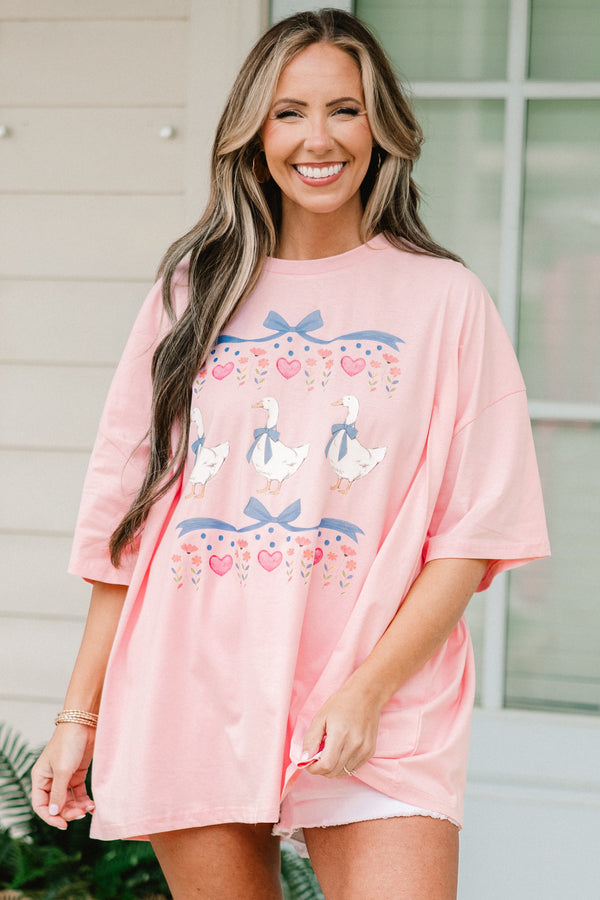 Plus Size dusty pink oversized boyfriend tee with a vintage coquette geese and bow graphic.