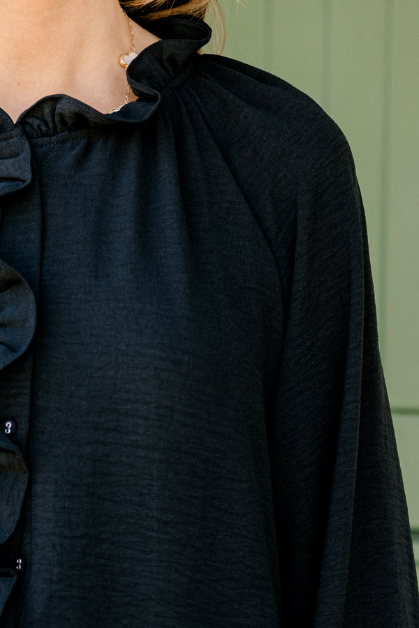 Chic Soul Plus size clothing, black solid colored blouse with long bubble sleeves and ruffle details on the neckline and down the cent of the shirt 
