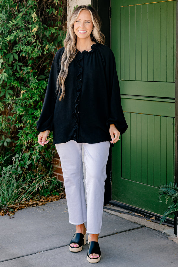 Chic Soul Plus size clothing, black solid colored blouse with long bubble sleeves and ruffle details on the neckline and down the cent of the shirt 
