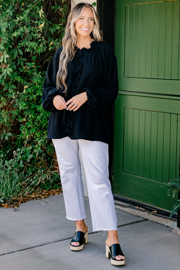 Chic Soul Plus size clothing, black solid colored blouse with long bubble sleeves and ruffle details on the neckline and down the cent of the shirt 
