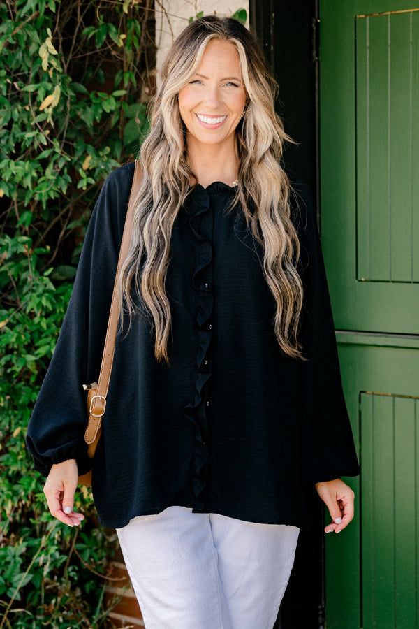 Chic Soul Plus size clothing, black solid colored blouse with long bubble sleeves and ruffle details on the neckline and down the cent of the shirt 
