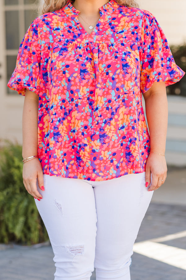 Plus Size hot pink floral top with elastic bubble sleeves and a V-neckline.