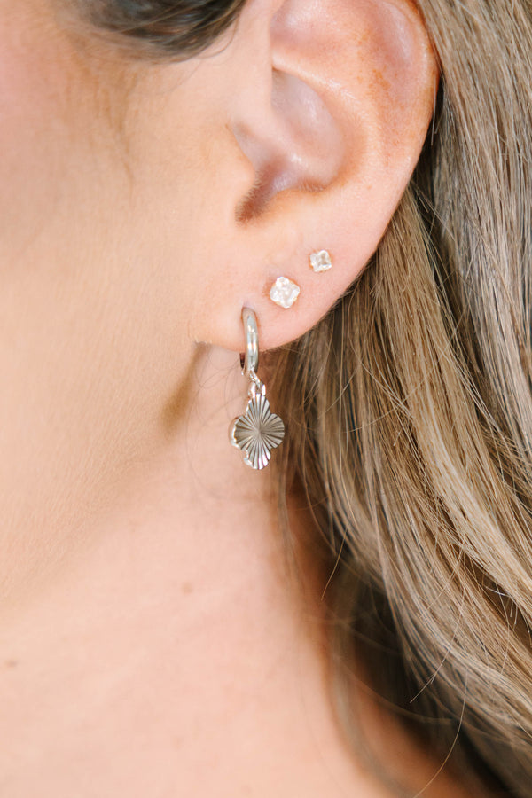 Plus Size silver hoop earrings with a textured four-leaf clover charm and small square studs.