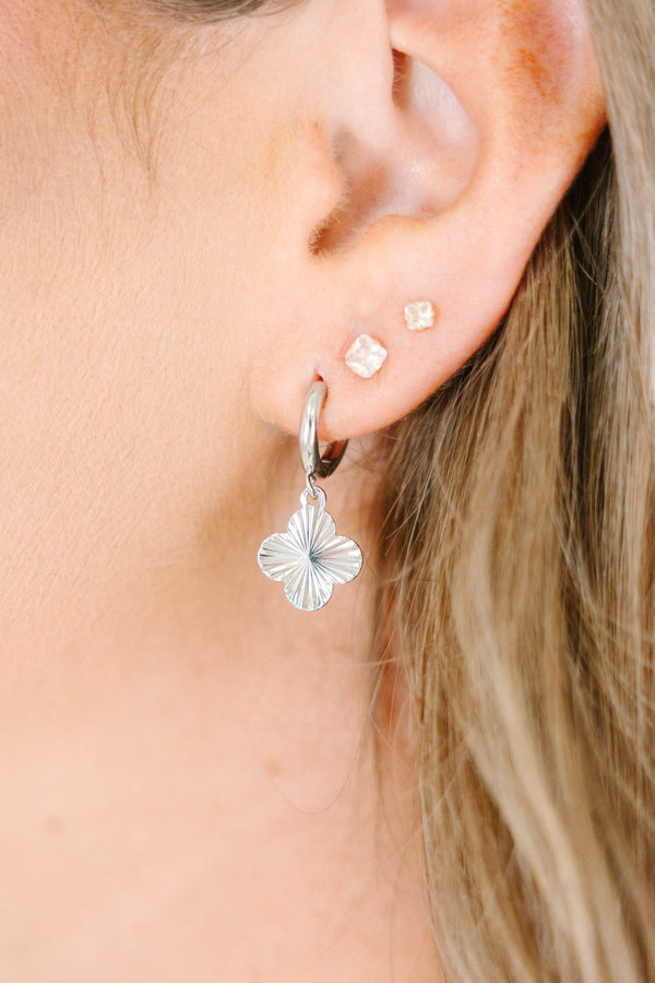 Plus Size silver hoop earrings with a textured four-leaf clover charm and small square studs.