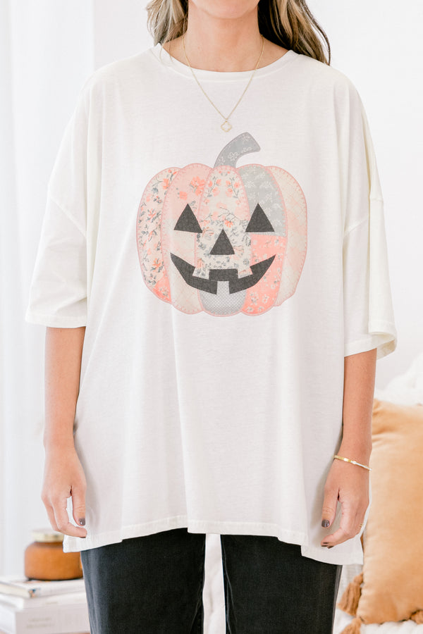 Chic Soul plus size clothing, Ivory short sleeve graphic tee with a jack-O-lantern on the center of the shirt that is filled with various patterns 