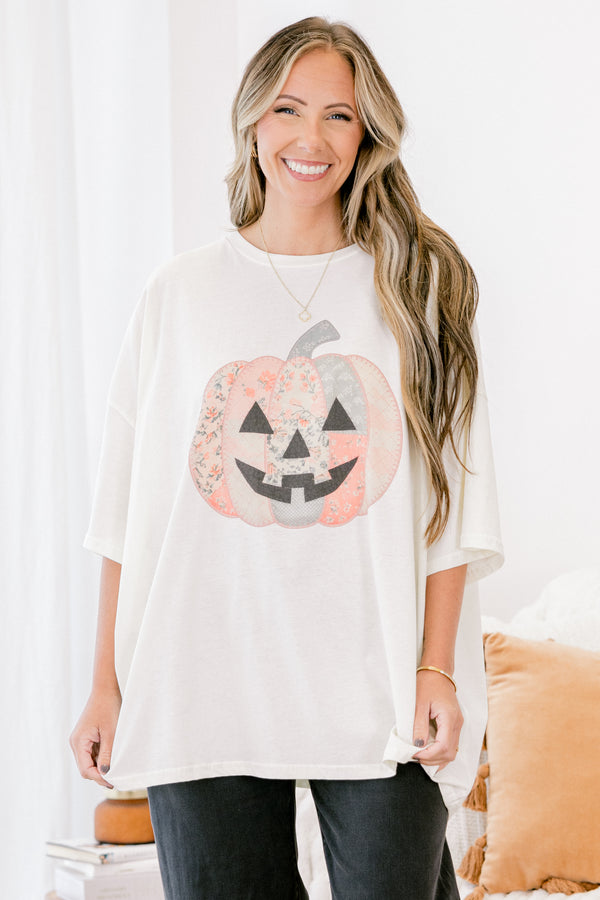 Chic Soul plus size clothing, Ivory short sleeve graphic tee with a jack-O-lantern on the center of the shirt that is filled with various patterns 