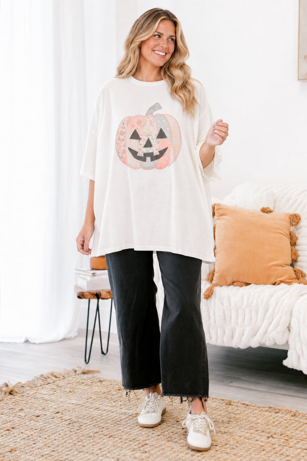 Chic Soul plus size clothing, Ivory short sleeve graphic tee with a jack-O-lantern on the center of the shirt that is filled with various patterns 