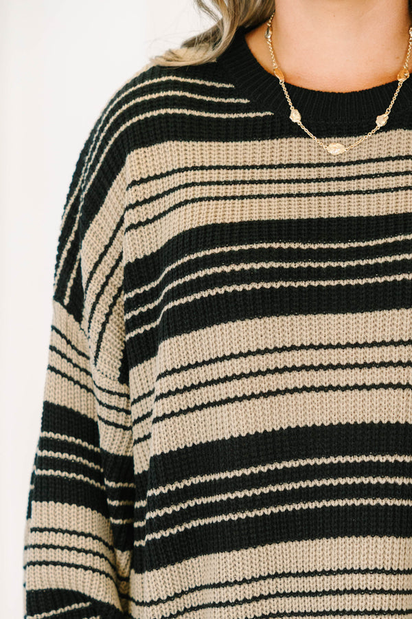 Plus Size oversized black and tan striped knit sweater with a crew neck and wide long sleeves.