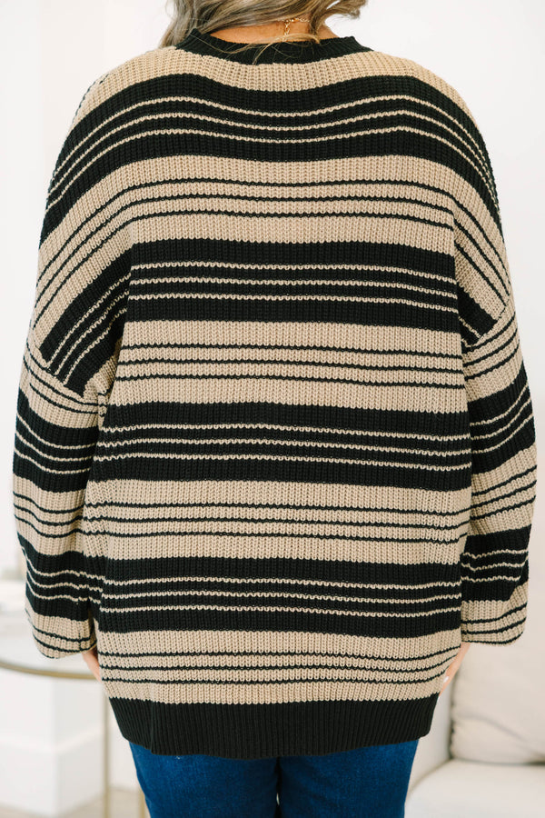 Plus Size oversized black and tan striped knit sweater with a crew neck and wide long sleeves.