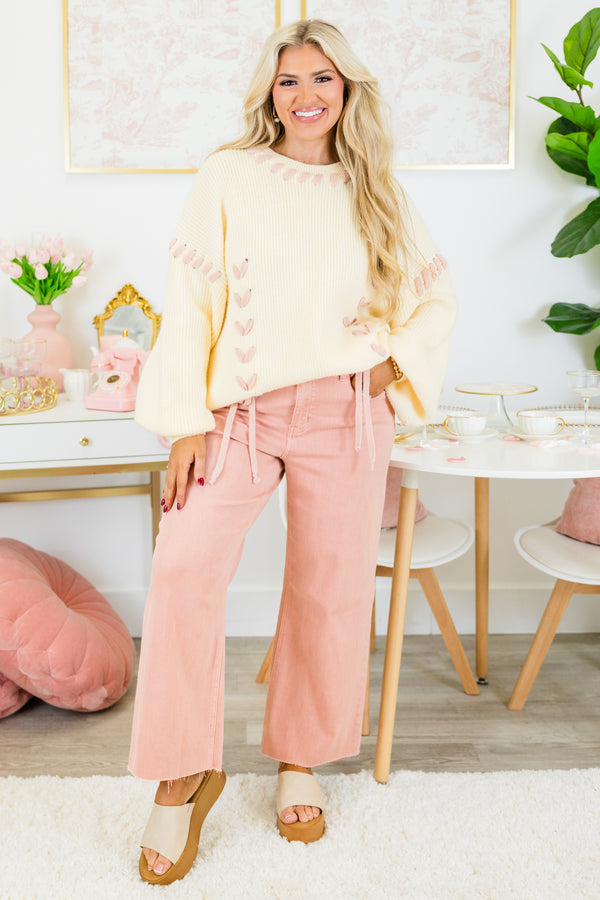 Chic Soul plus size clothing, rose colored jeans with raw hem