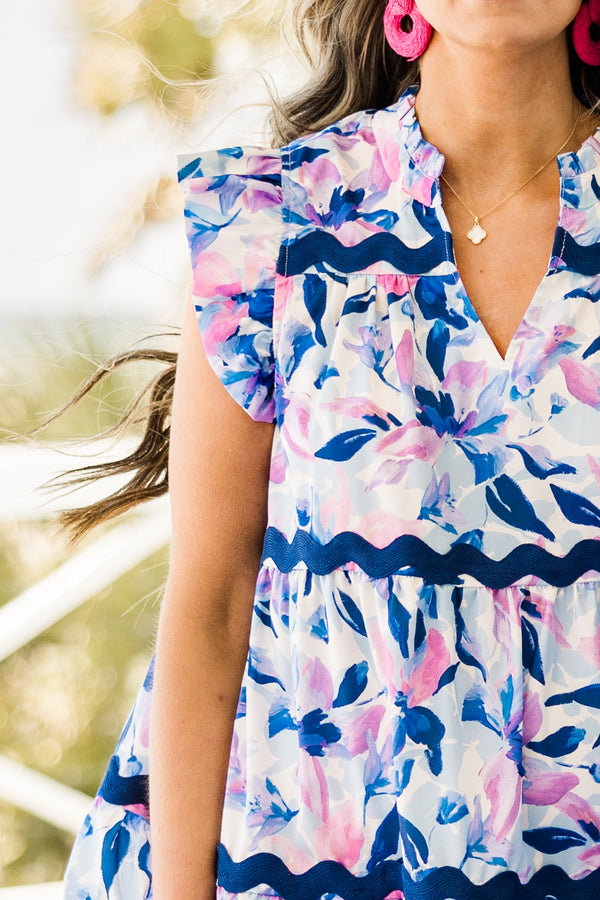 Chic Soul plus size clothing, short-flutter-sleeve navy ruffled baby doll short dress with a split-v-neckline and a purple and navy floral pattern with navy blue scalloped lining along the dress 