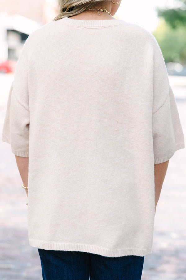 Plus Size taupe short sleeve sweater with a crew neckline and relaxed fit in a soft knit fabric.