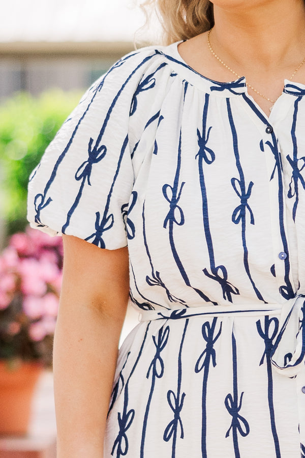 Chic Soul plus size clothing, short sleeve off-white dress with button detailing and waist tie with navy blue bow pattern