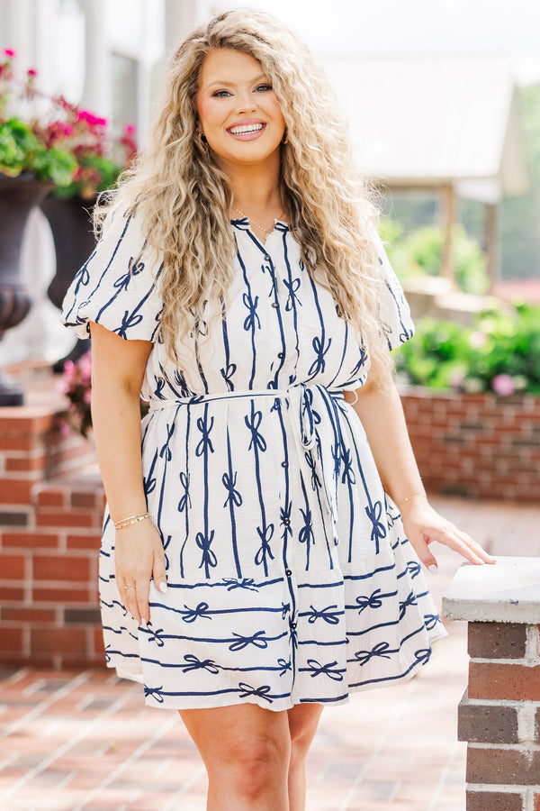 Chic Soul plus size clothing, short sleeve off-white dress with button detailing and waist tie with navy blue bow pattern