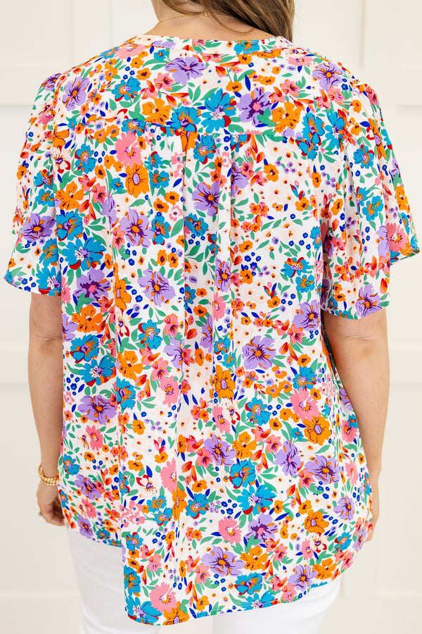 Chic Soul Plus size clothing, White short sleeve top with a multi-color floral pattern 