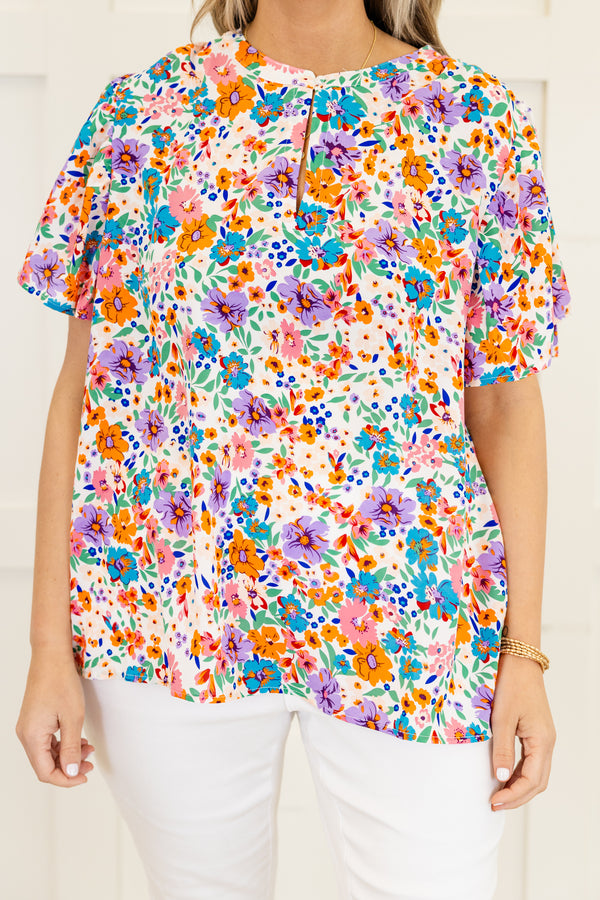 Chic Soul Plus size clothing, White short sleeve top with a multi-color floral pattern 