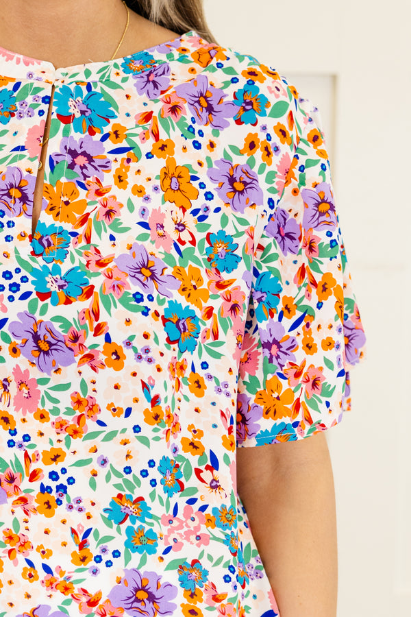Chic Soul Plus size clothing, White short sleeve top with a multi-color floral pattern 