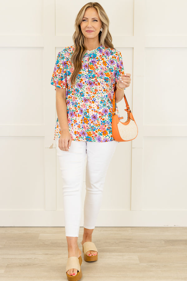 Chic Soul Plus size clothing, White short sleeve top with a multi-color floral pattern 