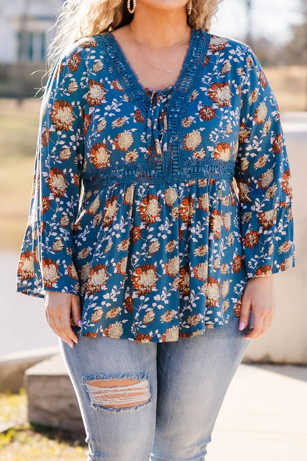 Chic Soul plus size clothing, blue flare sleeve long sleeve top with orange/ivory floral design with tie detail on neckline and lace along waist and collar