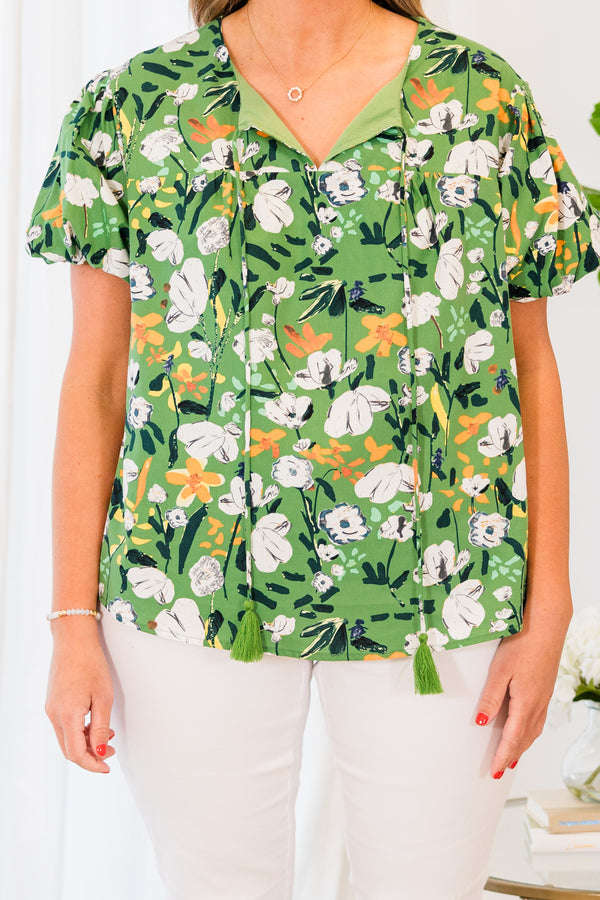 Chic Soul plus size clothing, short sleeve green top with white and yellow floral details with tassels on the collar 