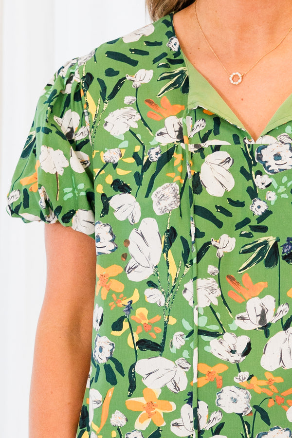 Chic Soul plus size clothing, short sleeve green top with white and yellow floral details with tassels on the collar 